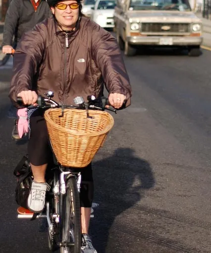 Person riding bike with basket
