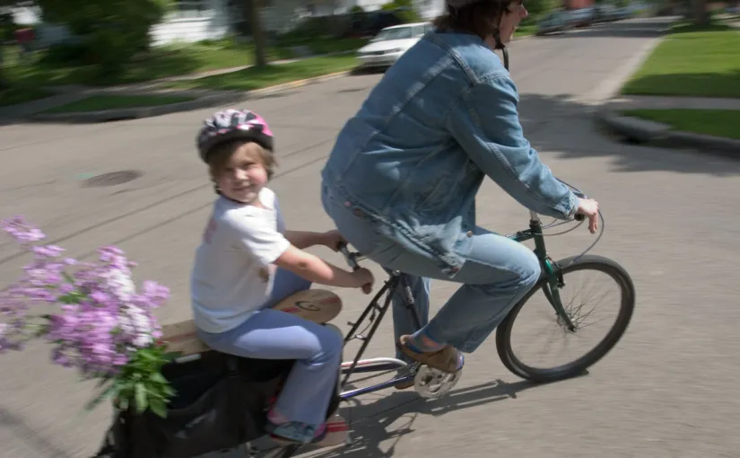 Cargo biking mom with daughter